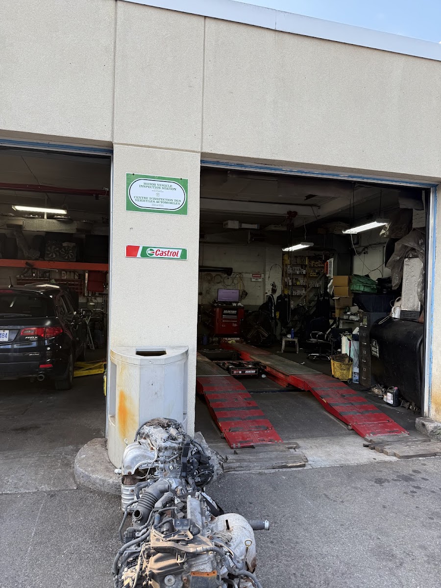 Open service bays at Bhalli Auto & Repair on Woodbine Avenue